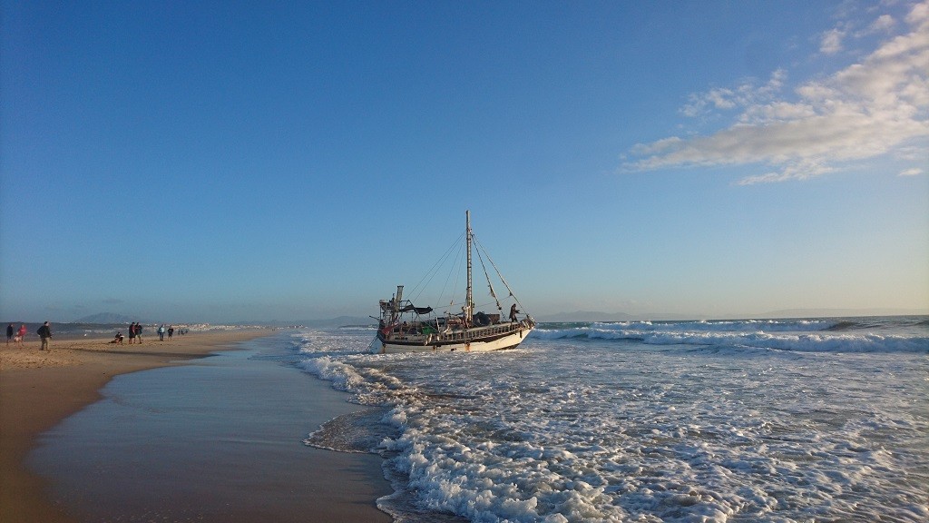 Sailboat Washes Ashore On The Beach Of Tarifa