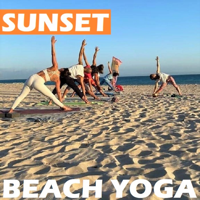 Sunset beach yoga in Tarifa Spain